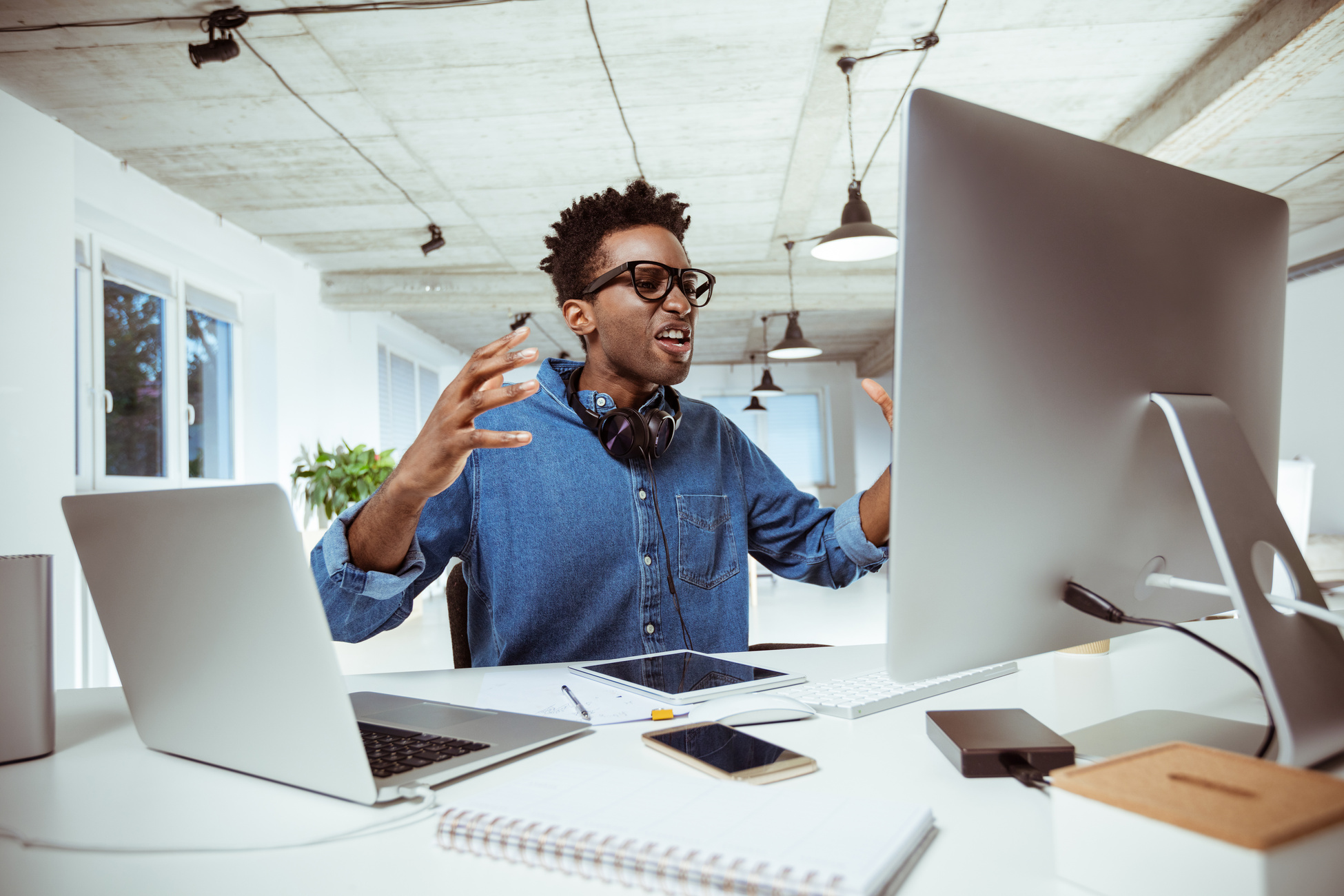 Frustrated businessman looking at computer monitor